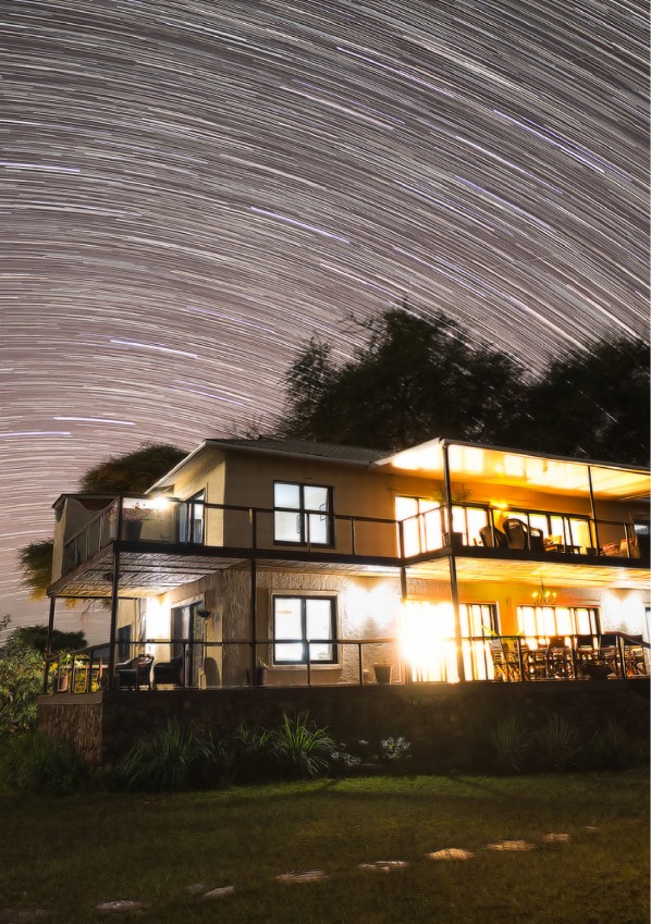 Lodge building beneath a star-filled Zambian night sky, from Jacana’s project portfolio